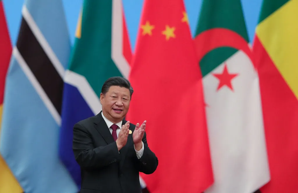 China's President Xi Jinping applauding as he attends the Forum On China-Africa Cooperation - Round Table Conference at the Great Hall of the People in Beijing on September 4, 2018.