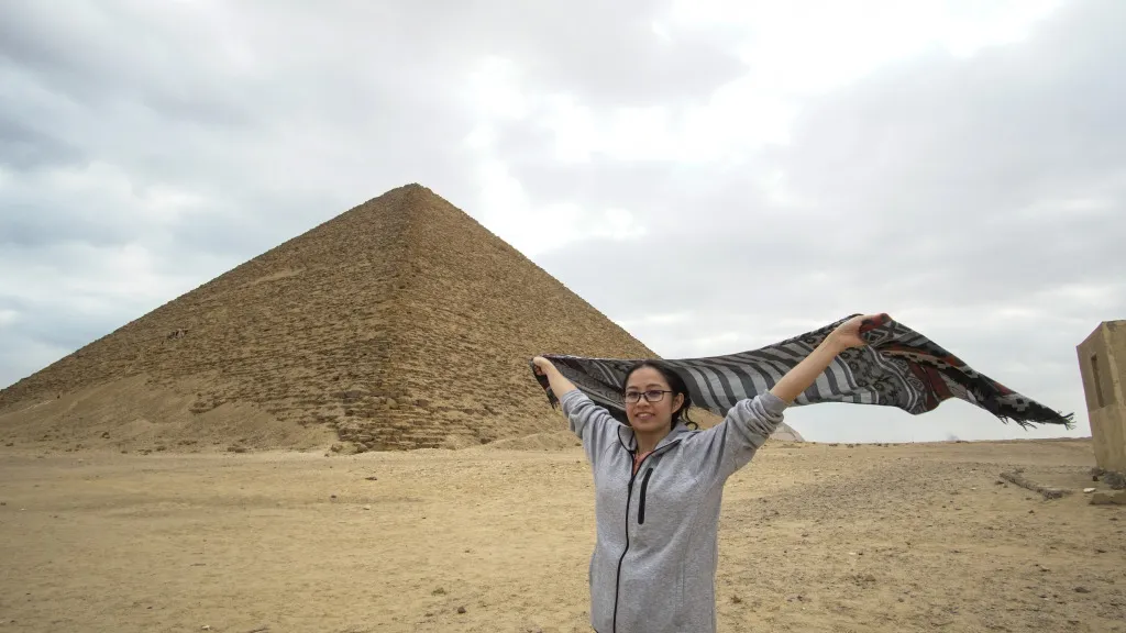 A Chinese tourist in front of the pyramids.