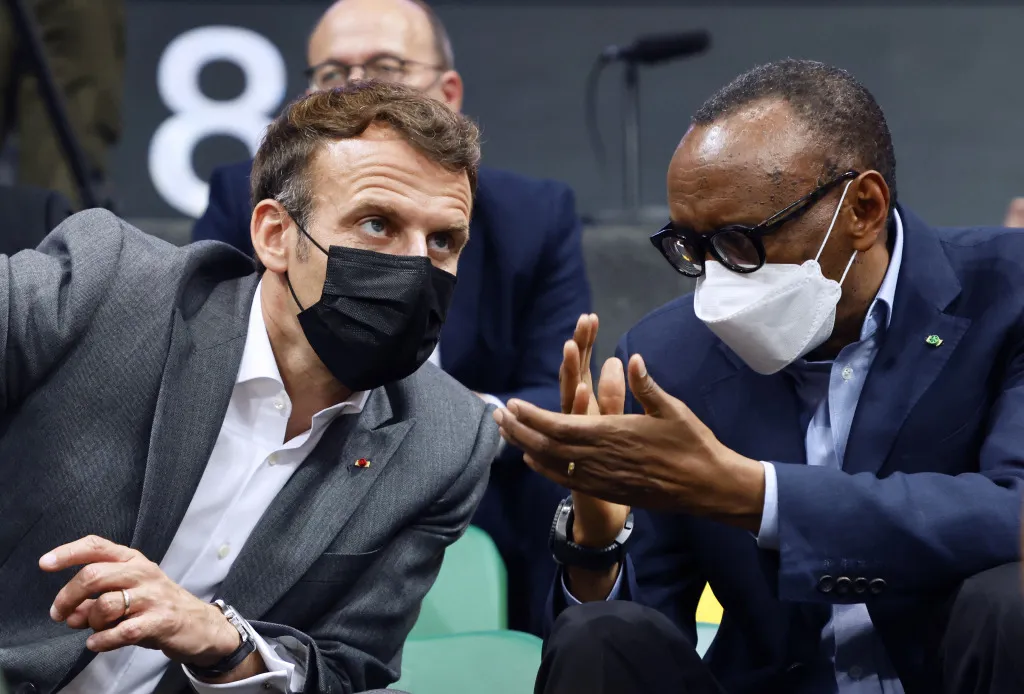French President Emmanuel Macron and Rwanda's President Paul Kagame speak during a Basketball Africa League (BAL) match in the Kigali Arena.