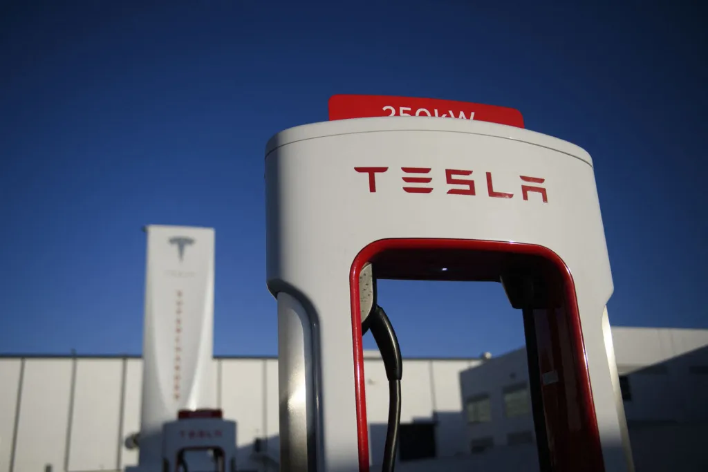 A Tesla logo is seen on a 250kW electric vehicle charging station.