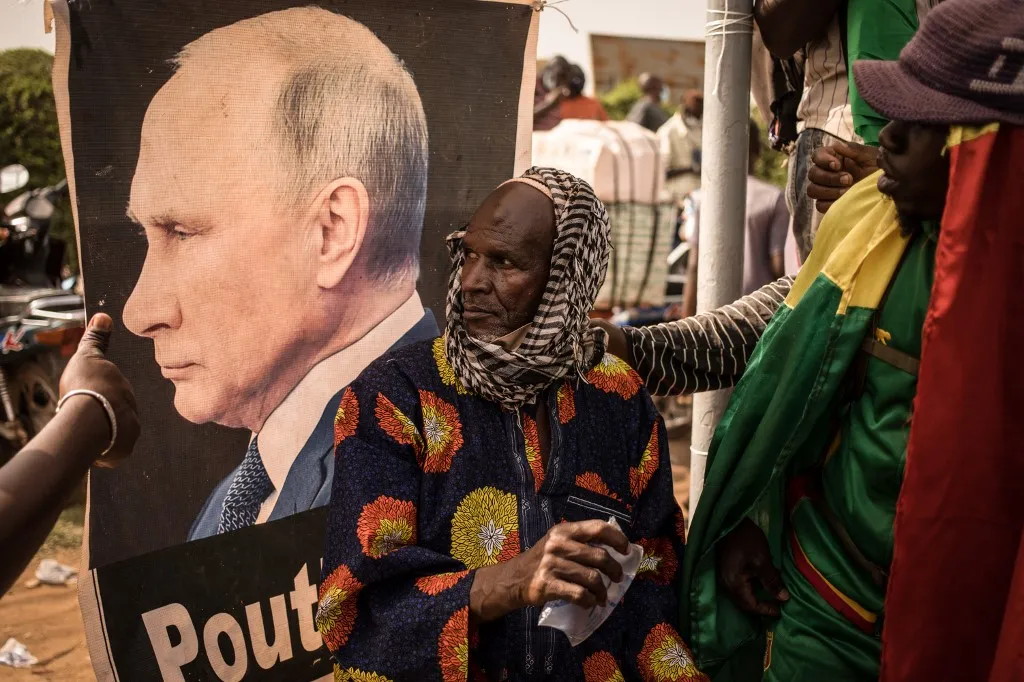 A portrait of Vladimir Putin on display during a demonstration in Bamako.