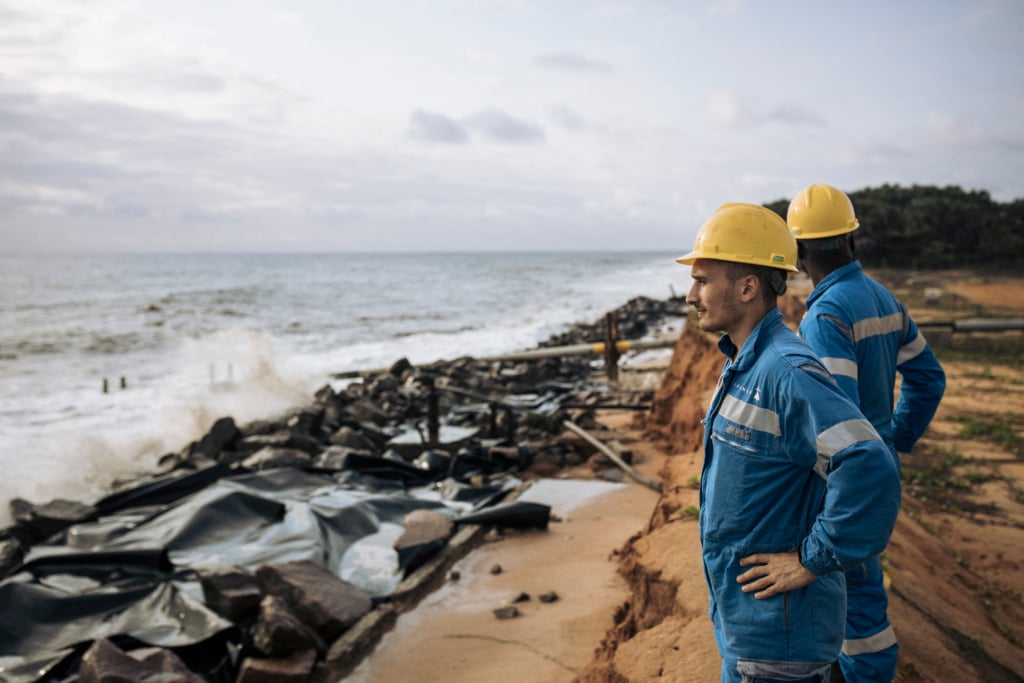 Perenco oil company managers and technicians on the beach in front of their oil pipeline in Democratic Republic of Congo.