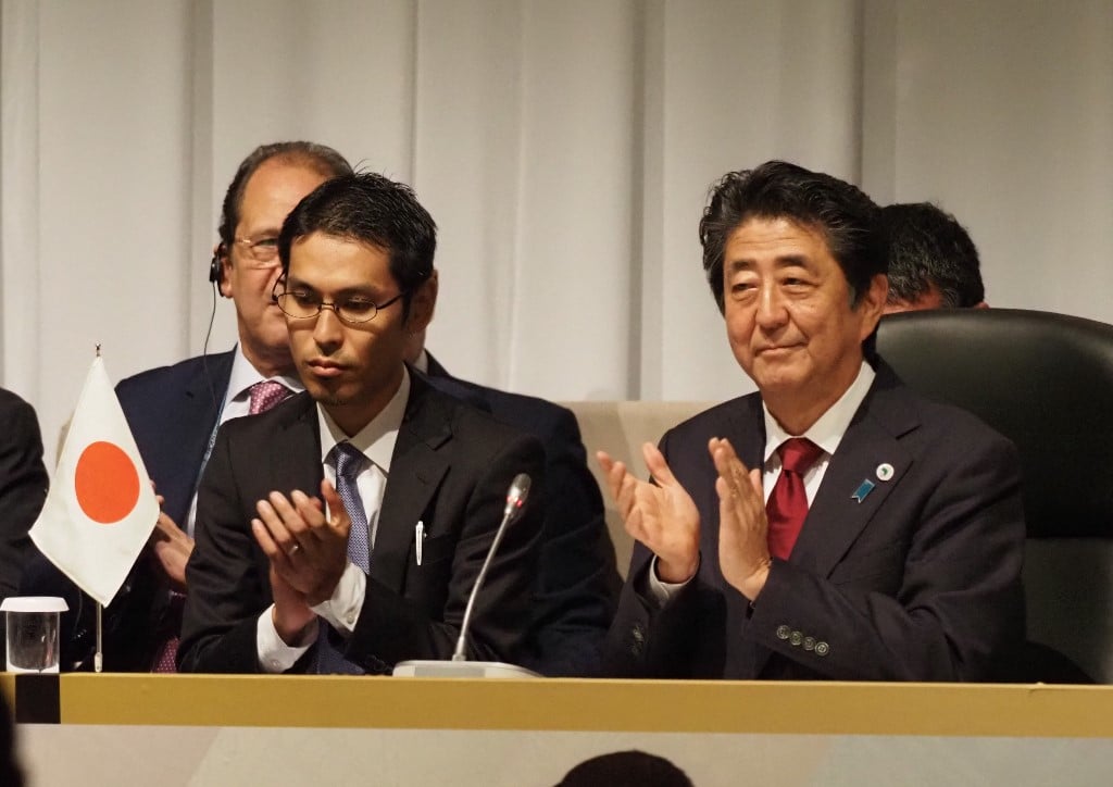 Shinzo Abe applauds at the closing ceremony of TICAD7