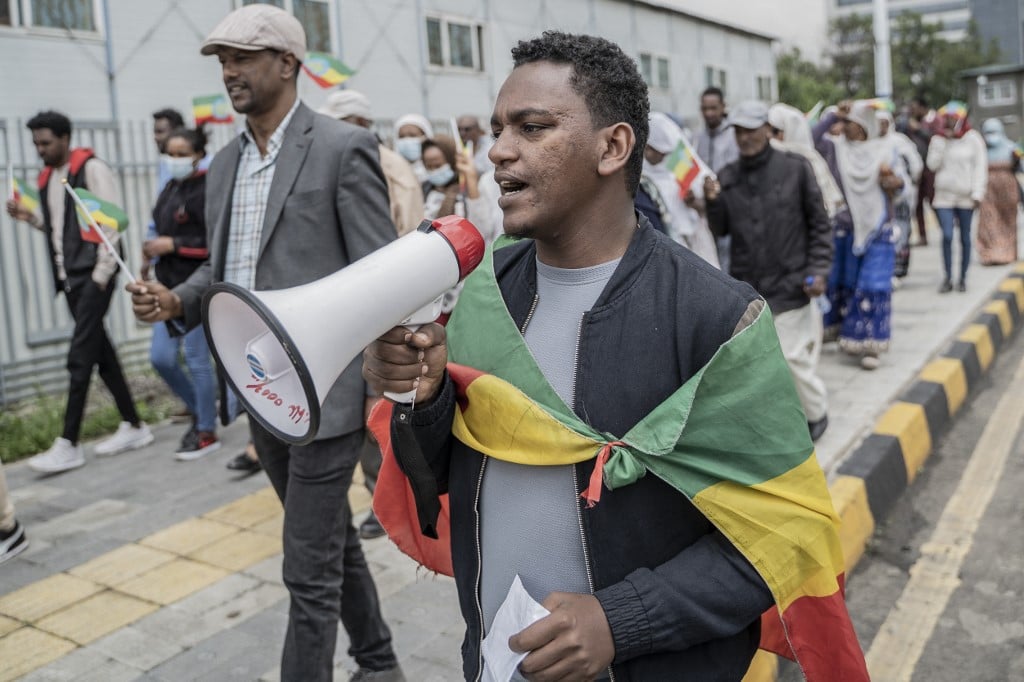 A Tigrayan demonstrator holding a loud speaker protests in Addis Ababa.