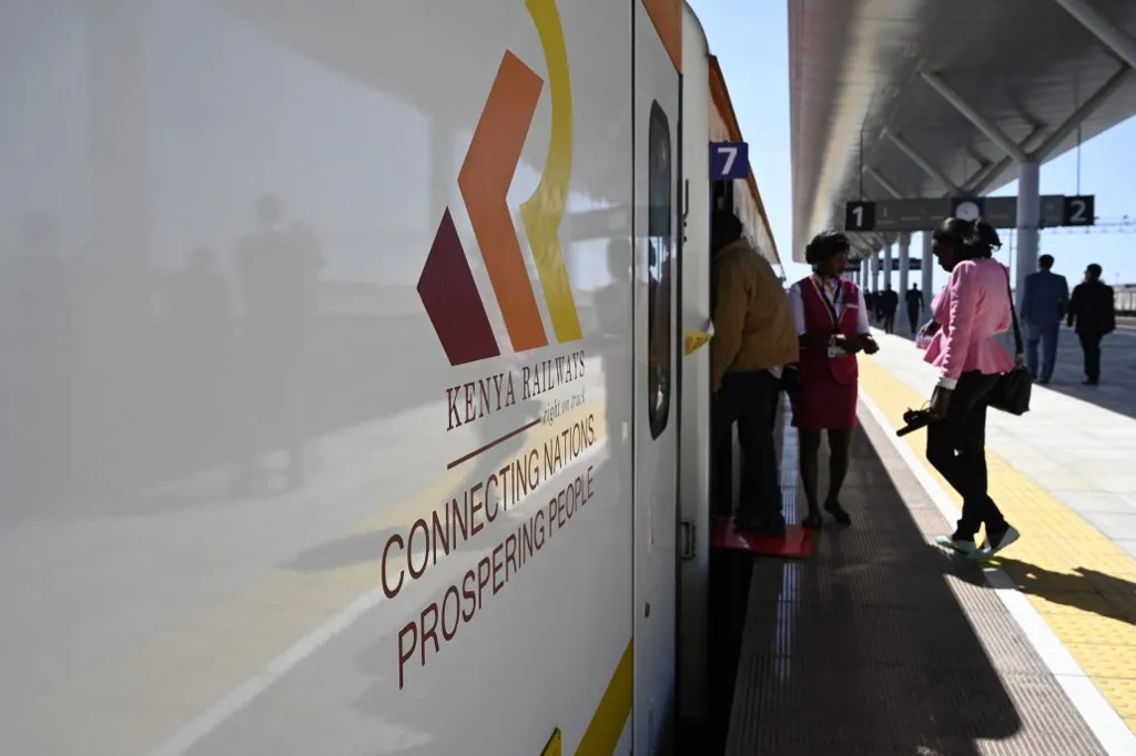 Passengers embark on a Kenya Railways train.